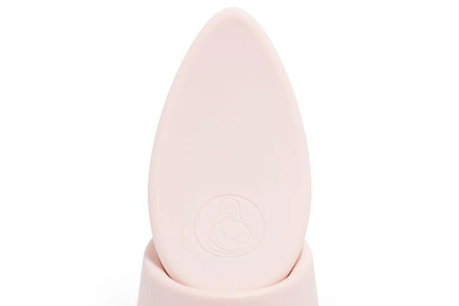 A small pink breast massager