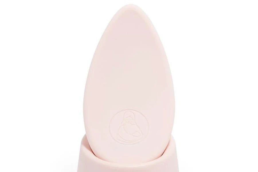 A small pink breast massager