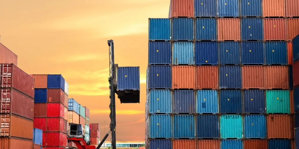 a stack of shipping containers in various colors