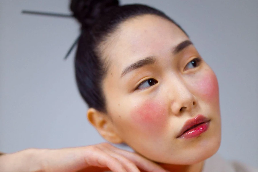 an Asian woman waring colorful blush