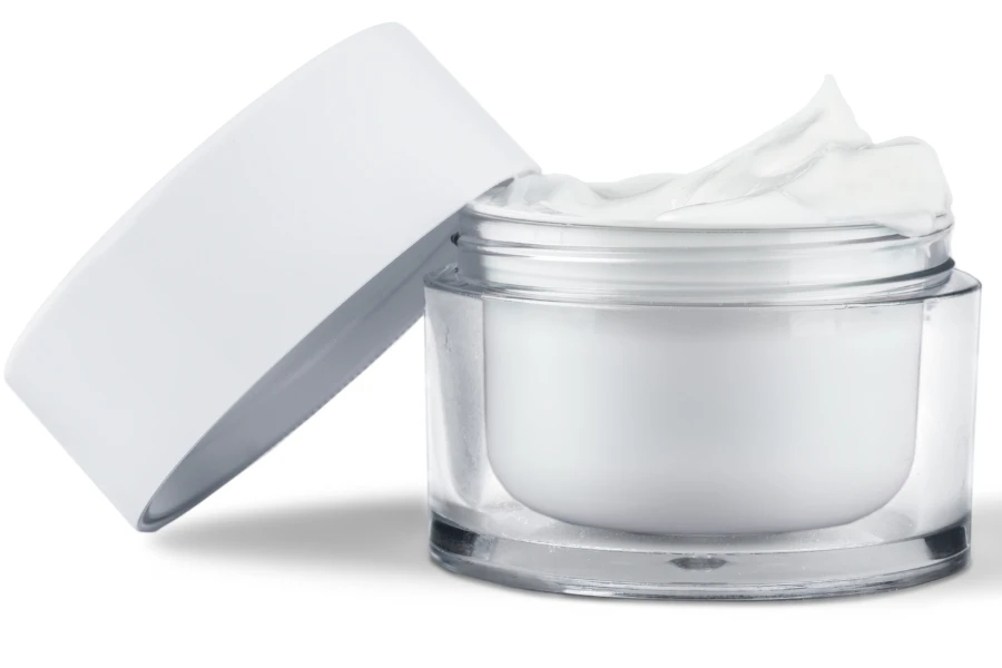 An open moisturizer on a plain white background