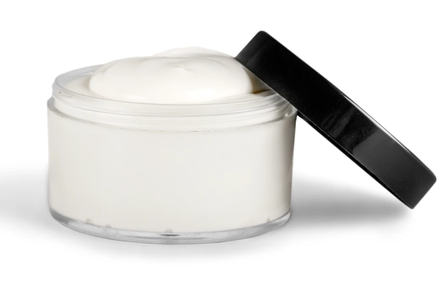 An open tattoo cream on a white background