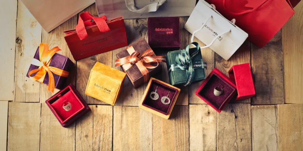 Assorted gift boxes on brown wooden floor