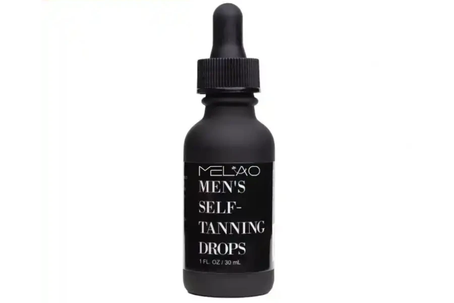 Black bottle of bronzing drops for men on a white background