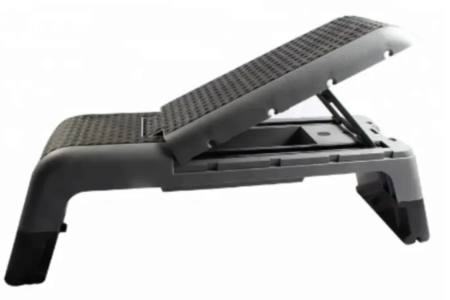 Black workout stepper bench with backrest on an angle