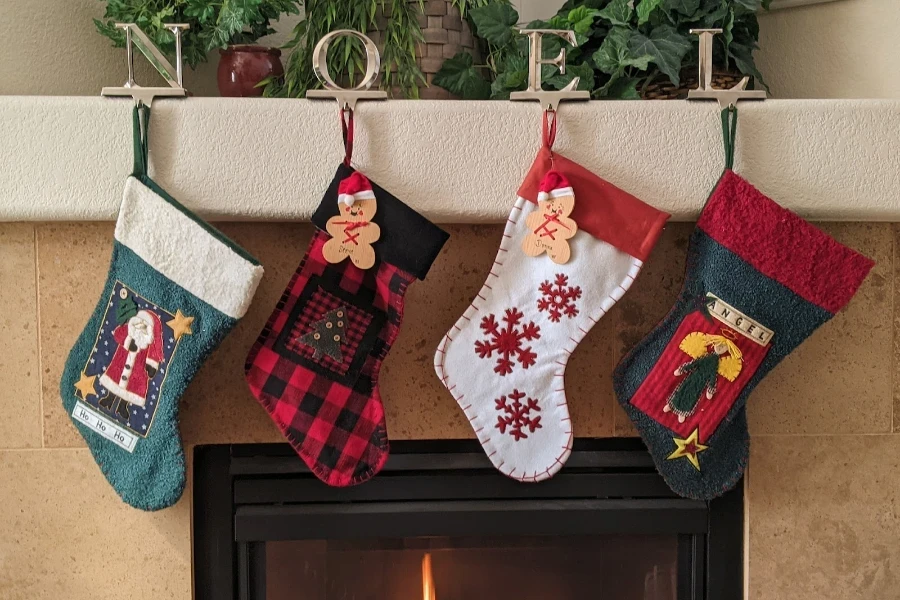 Christmas stockings hug on the mantle