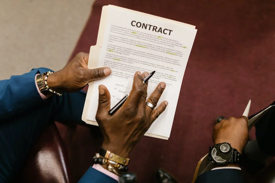 Close-up shot of a person holding a contract