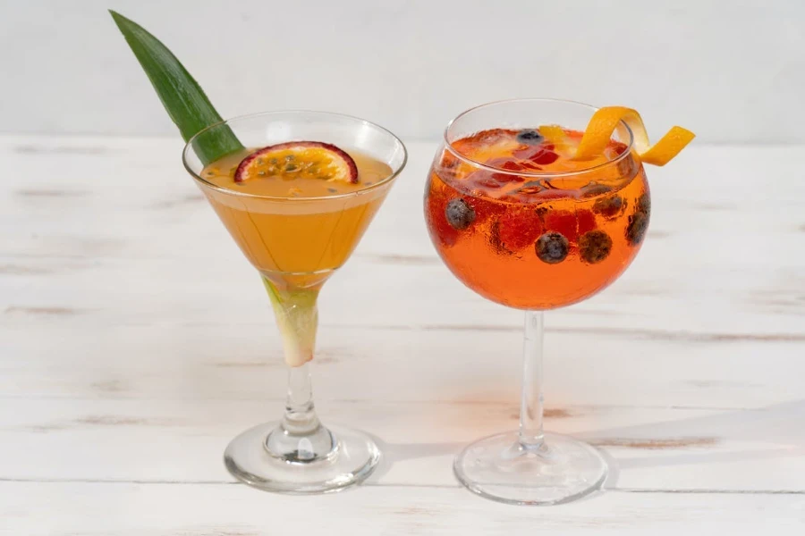 cocktail glasses with cocktails placed on a table