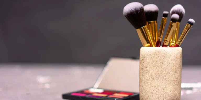 Different makeup brushes in a container