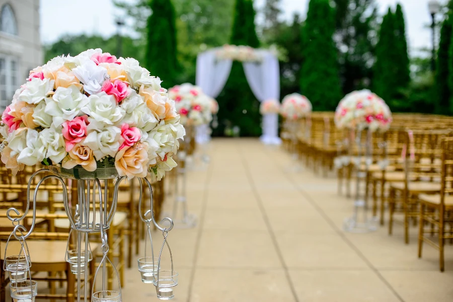Flowers arranged in an aisle at a wedding