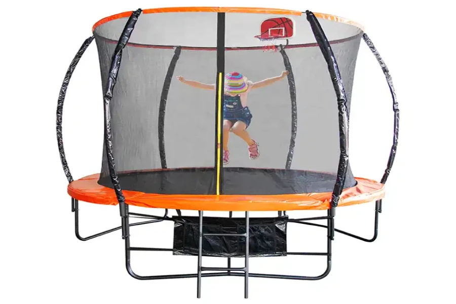 Girl jumping inside orange enclosed trampoline with basketball hoop