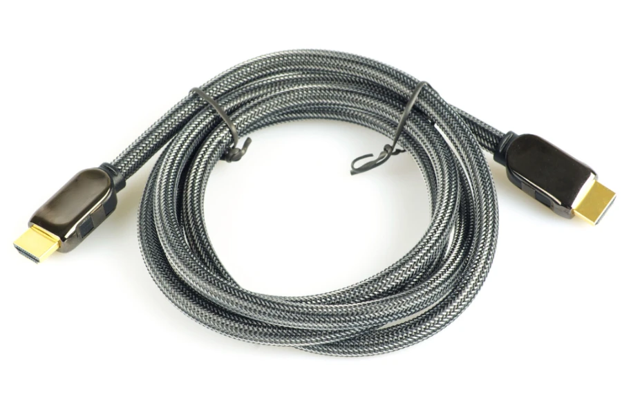 Grey and black rolled-up HDMI cable
