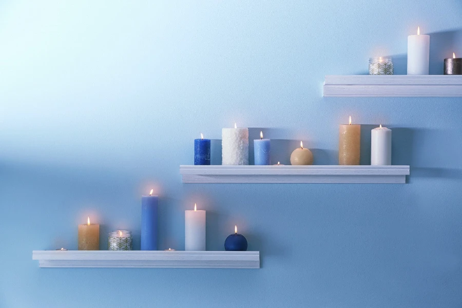 Ledge shelves with burning candles displayed on them