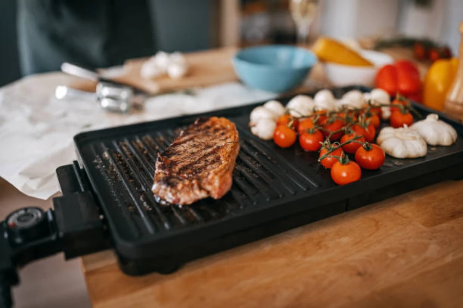 long electric grill for camping being used in indoor space