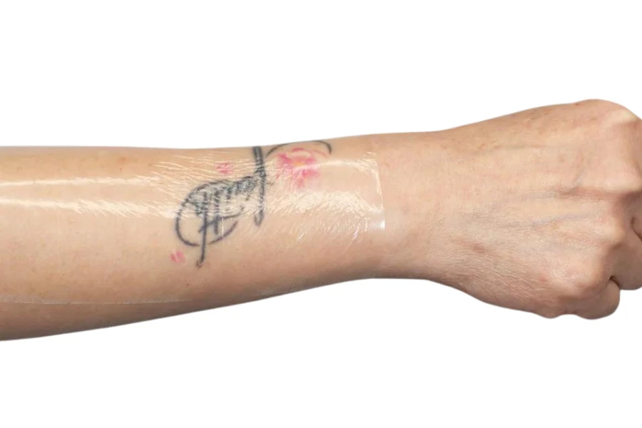 Protective tattoo film on a freshly tattooed arm