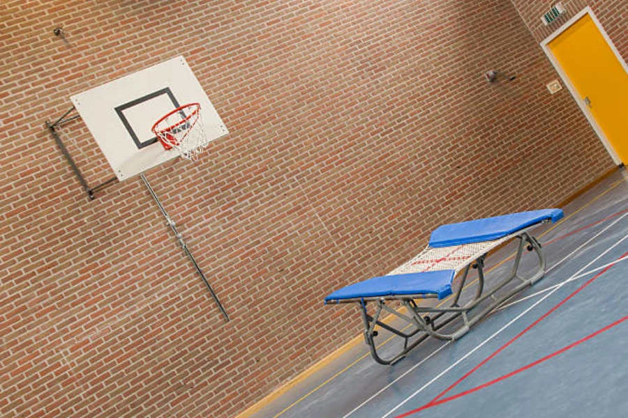 Rebounder trampoline set up in front of basketball net