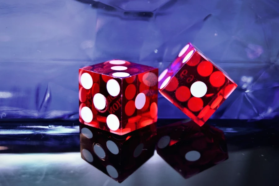 Red-colored six-sided die with white spots