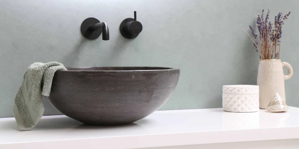 Round bowl sink on white countertop