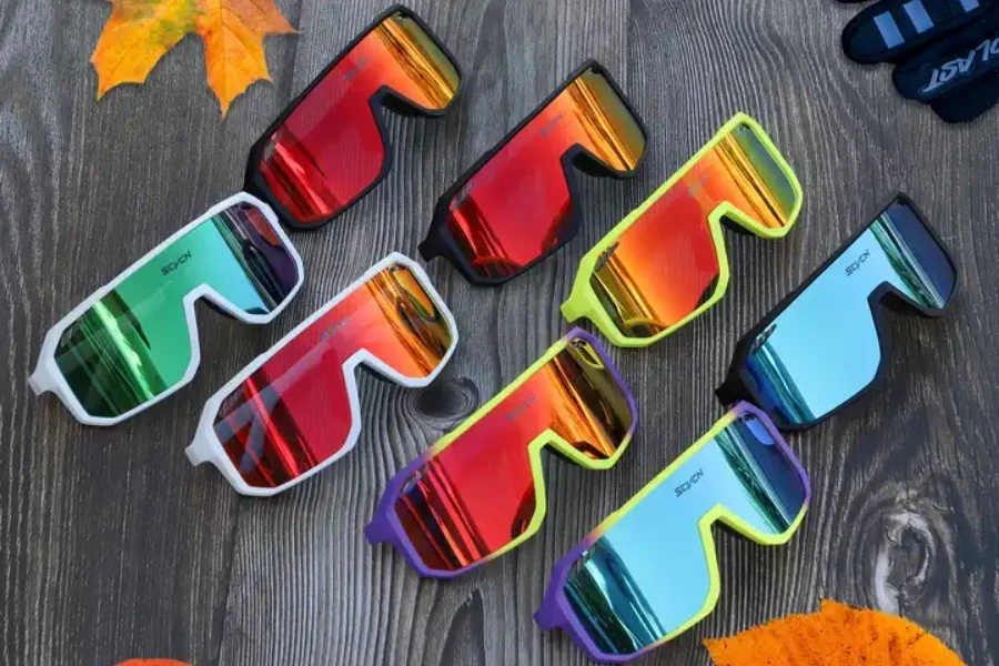 Selection of tinted squash goggles laid on wooden table