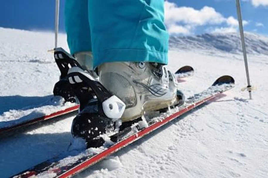 Skier on a slope wearing backcountry bindings