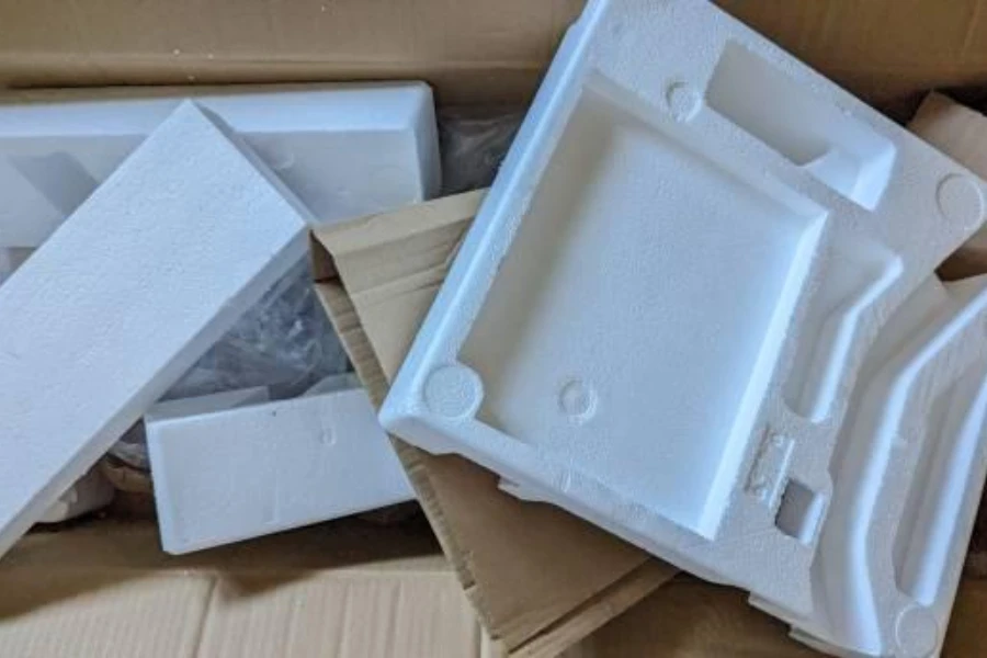 Styrofoam protective packaging and brown cardboard