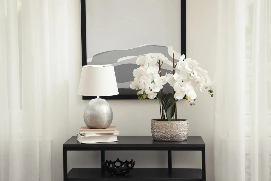 table lamp and a planter on console table