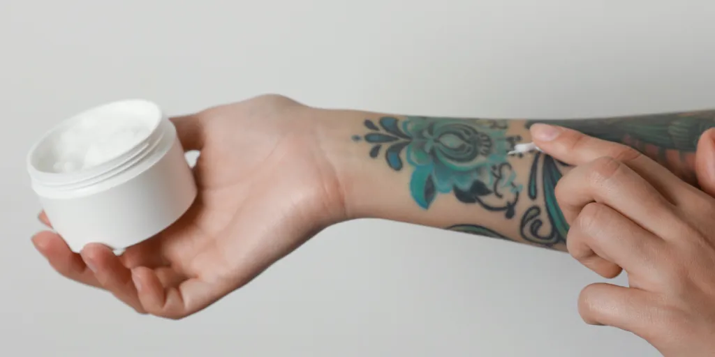 Tattoo cream being applied on an arm