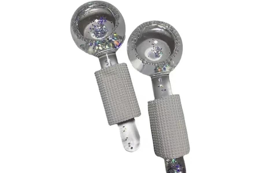 Two metallic-looking ice globe massagers