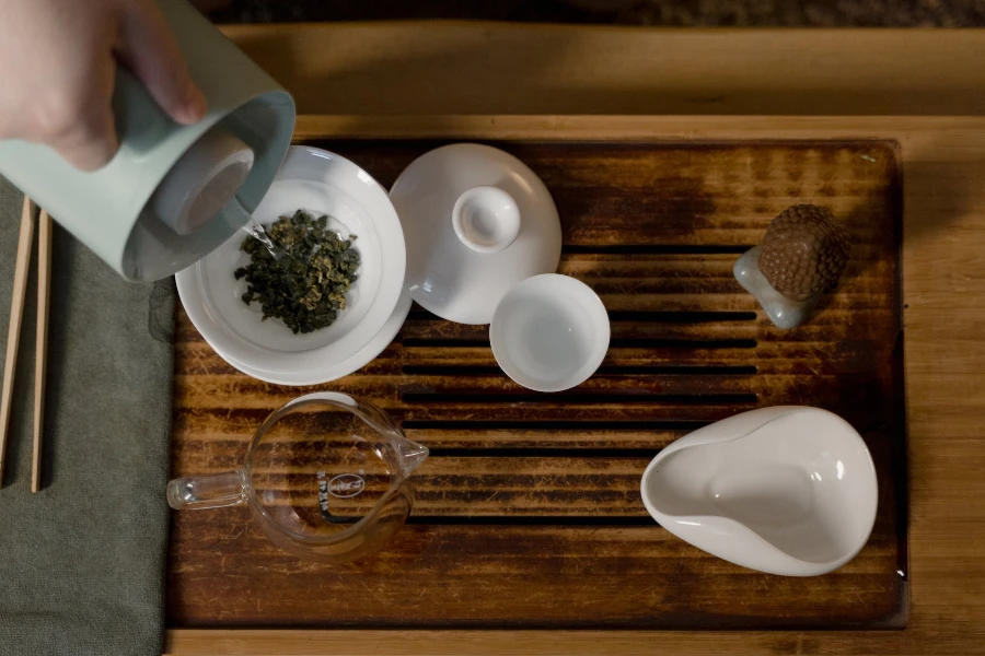 White ceramic tea set on a wooden board