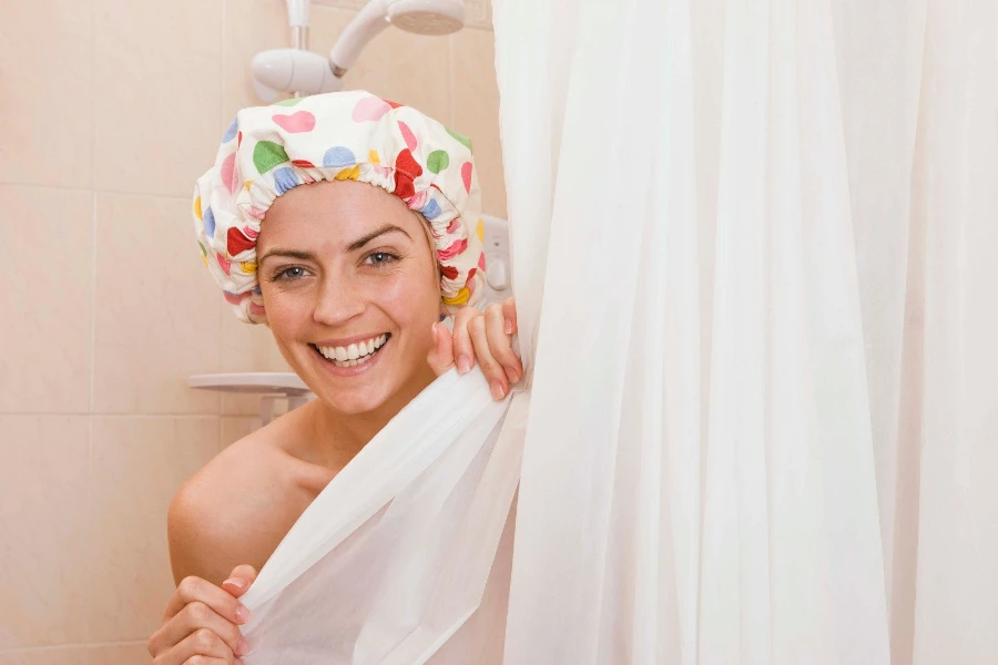 Woman covering her body with a shower curtain