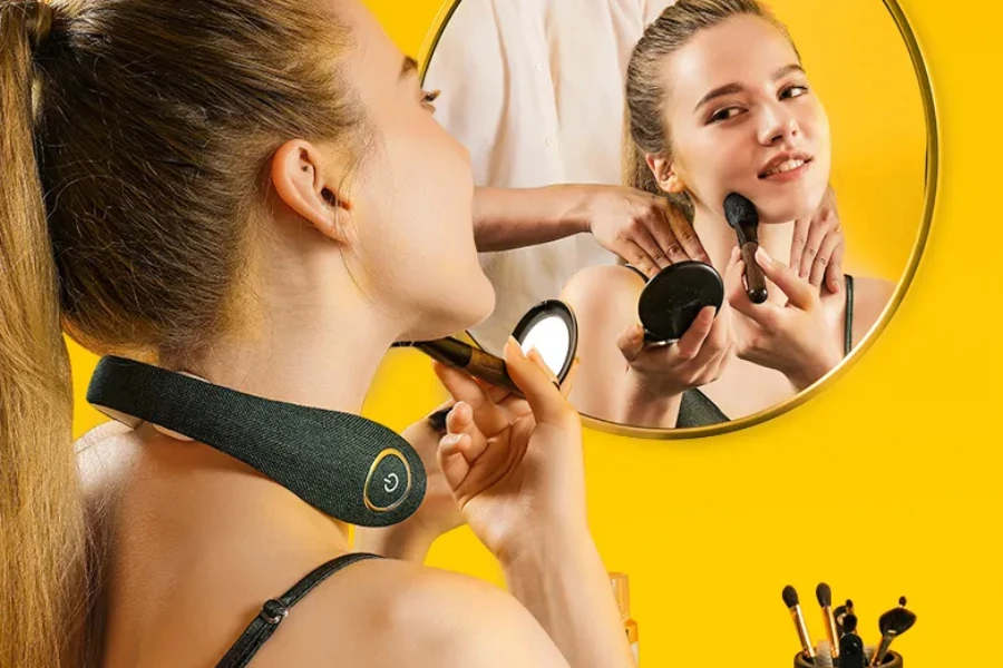 Woman putting on makeup while wearing green neck massager