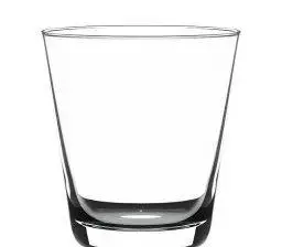 A clear glass tumbler with a thick base