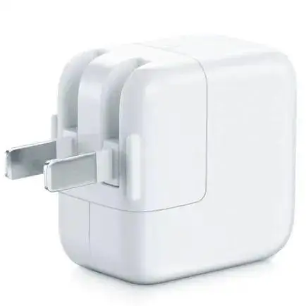 A white polycarbonate electrical plug adapter