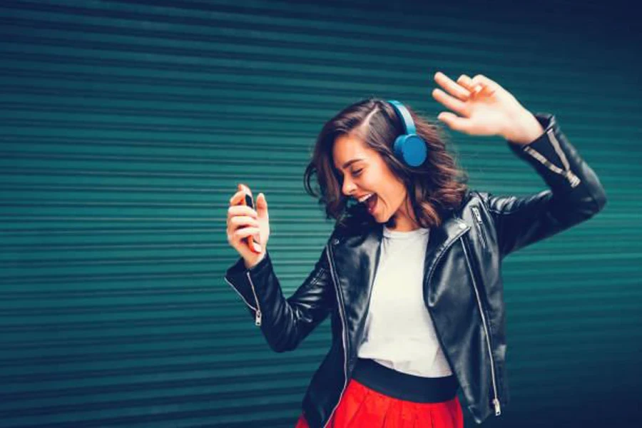 Woman dancing with headphones