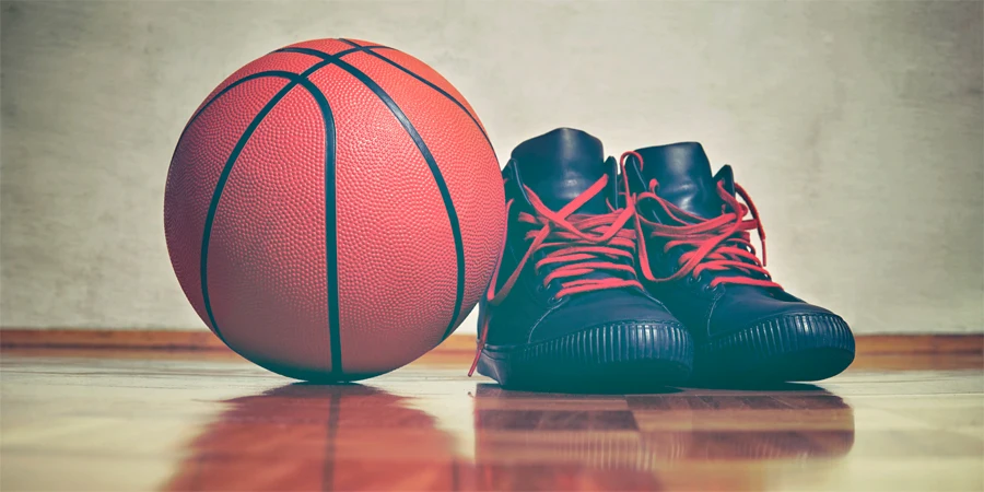a basketball and a pair of basketball shoes