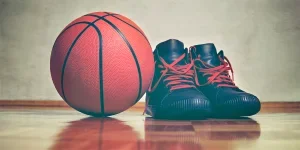 a basketball and a pair of basketball shoes
