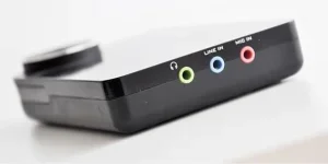 A black external sound card with multiple ports