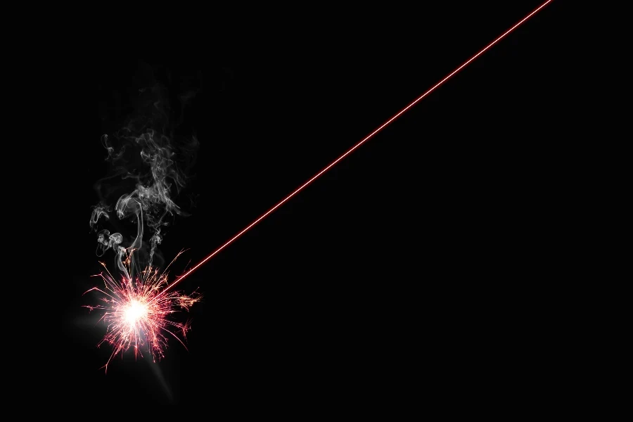 A high powered red laser pointer burning something