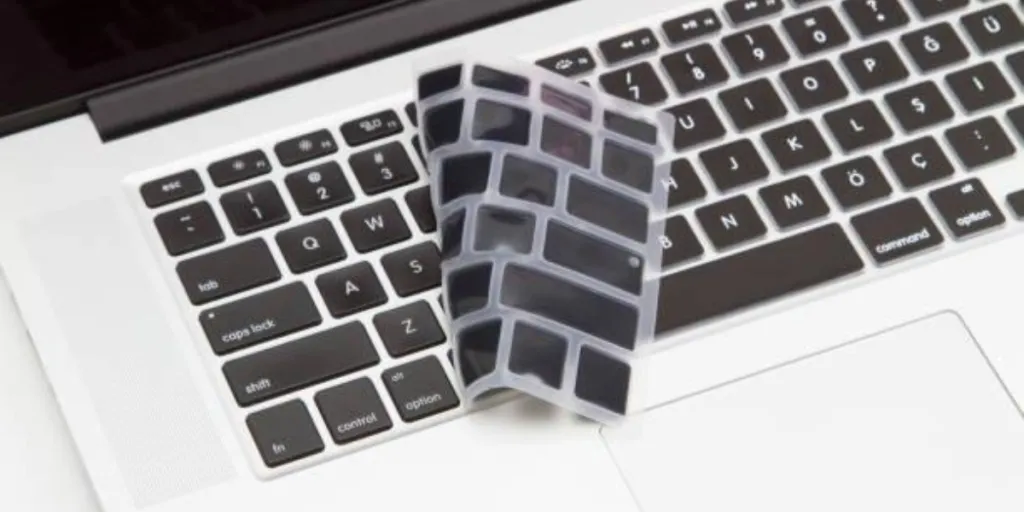 A keyboard cover on a silver laptop