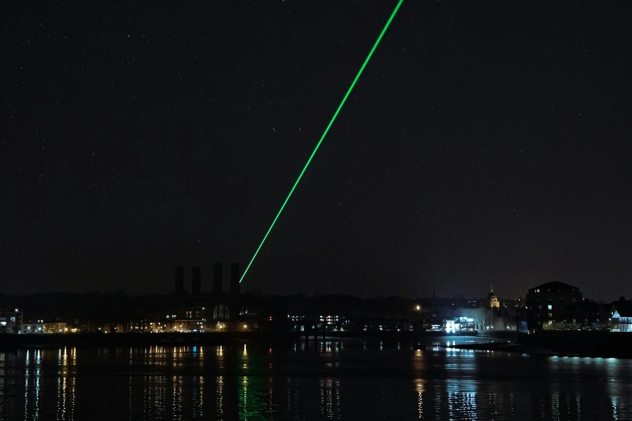 A laser pointer in a city at night