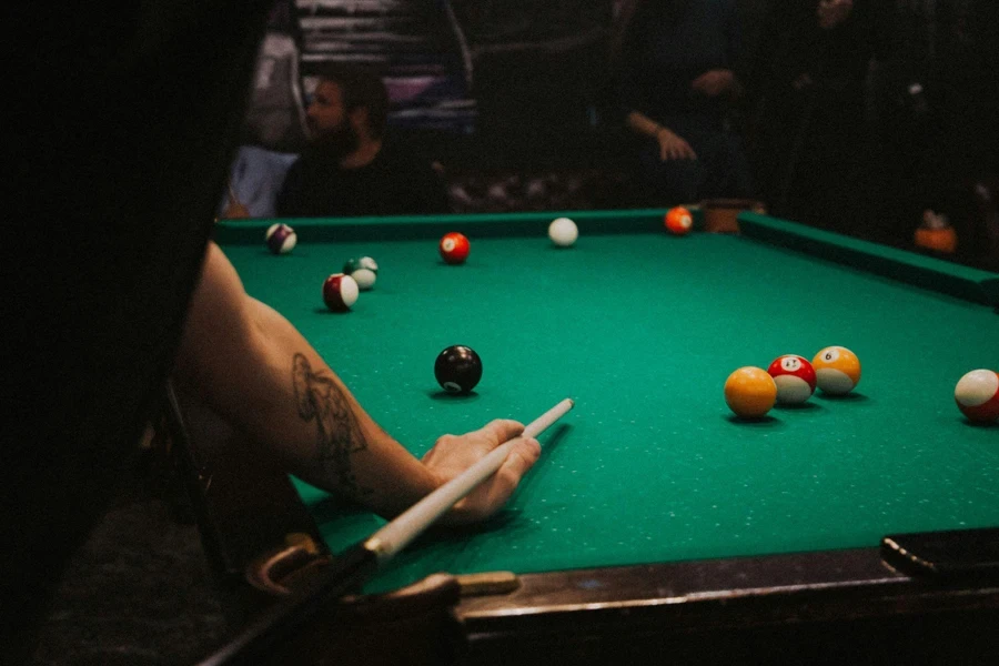 a man plays billiards