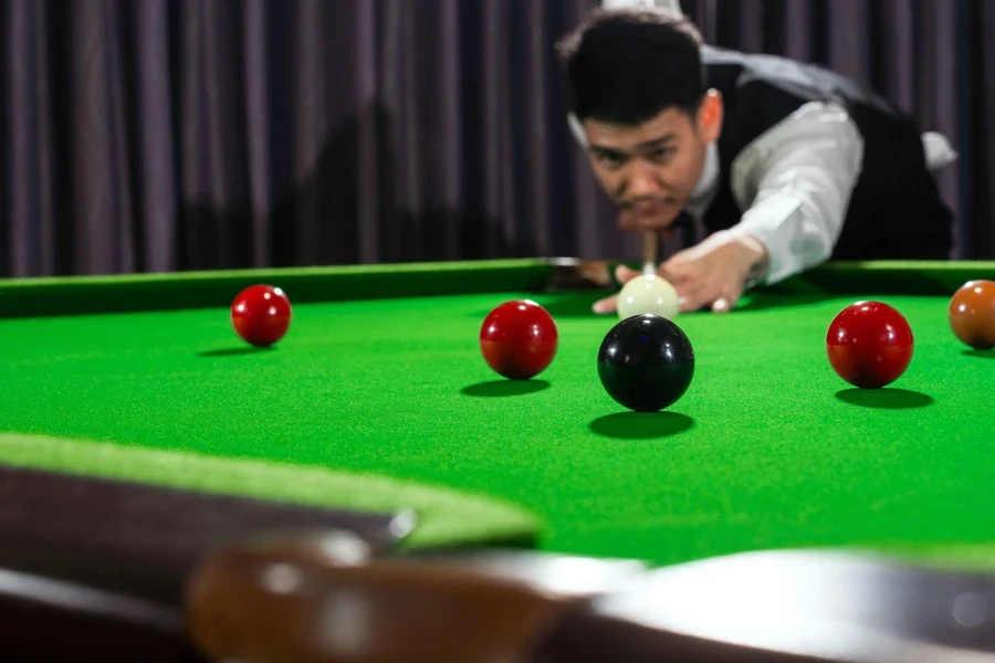 a man plays billiards