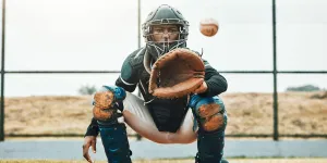 a man wearing a baseball glove is preparing to catch a baseball