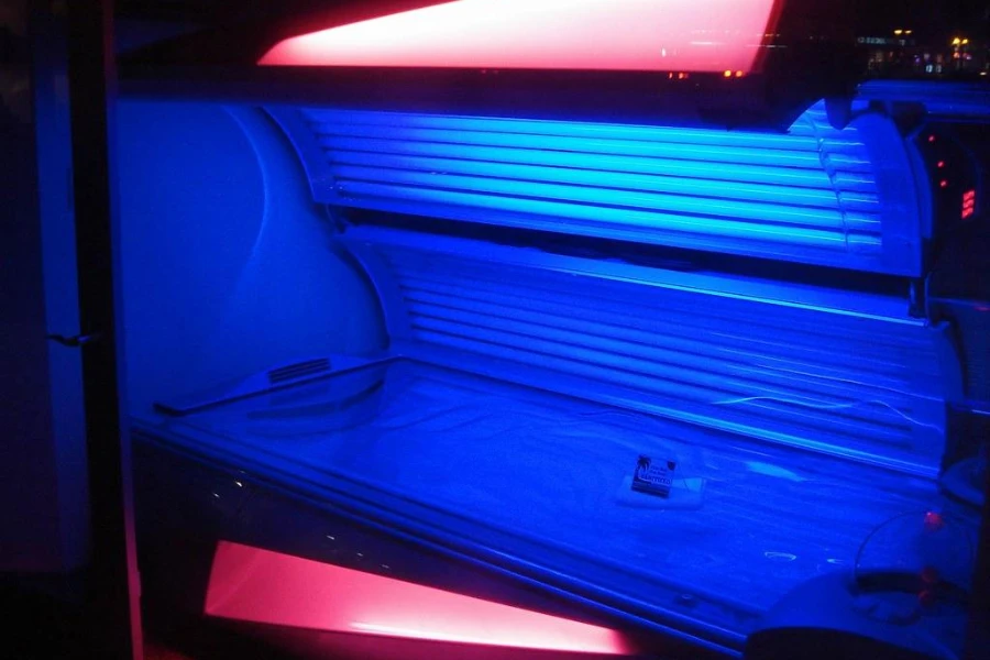 A red tanning bed with blue interior