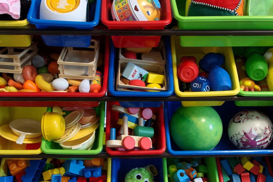 A variety of toys in a toy storage bin