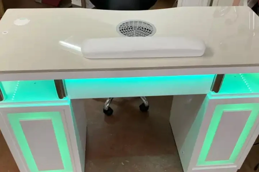 A white manicure table with built-in LED lights