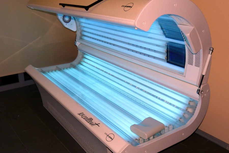 A white tanning bed with blue interior