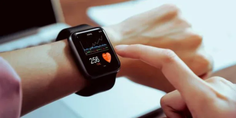 A young woman monitoring her heart rate with smartwatch