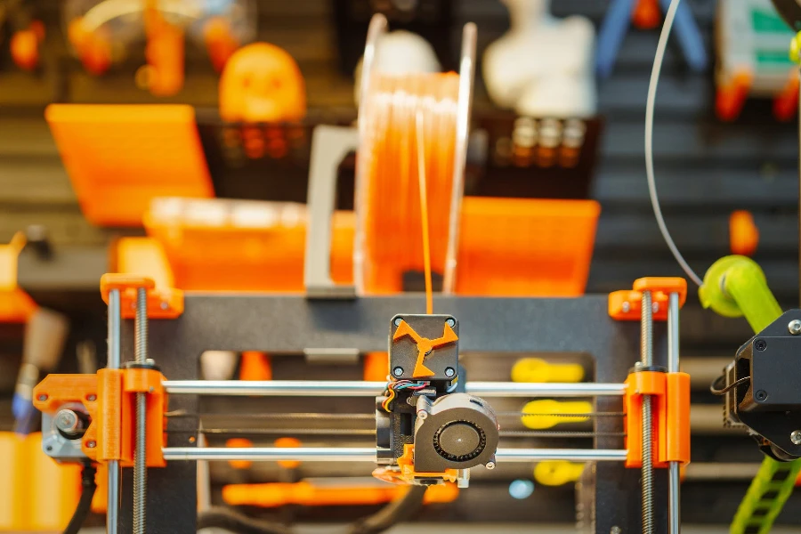 An orange 3D printer