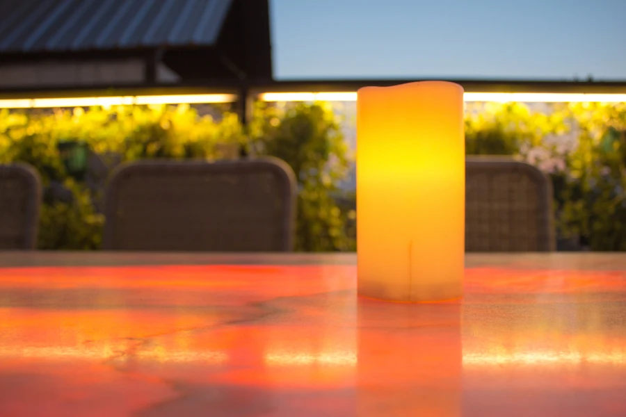 An outdoor candle on a table